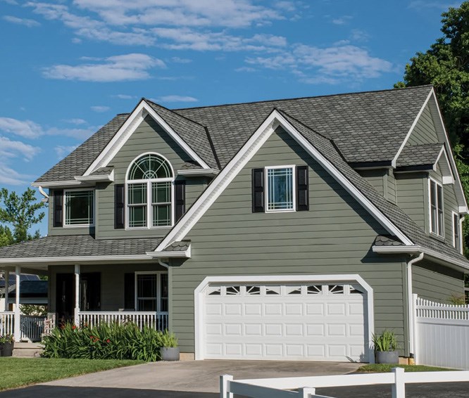 Home with green composite siding
