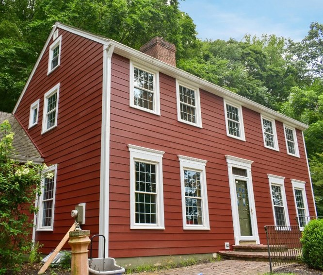 Home with red fiber cement siding