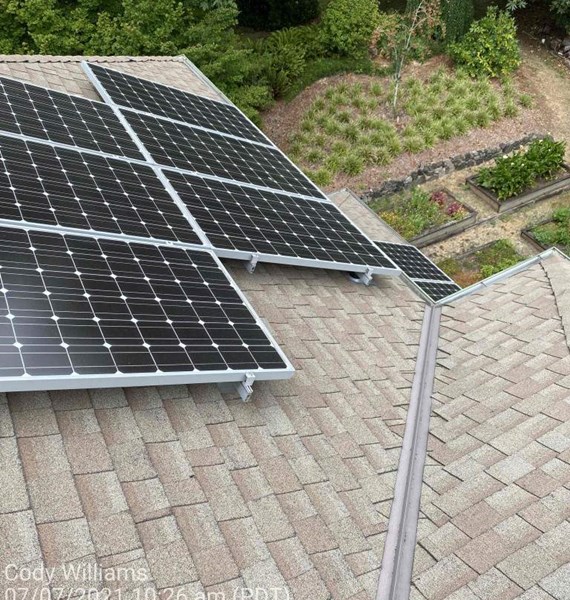 Solar panels installed on Bianbridge Island rooftop. New shingles and metal flashings were installed prior to the solar panels to support the life of the new panels.