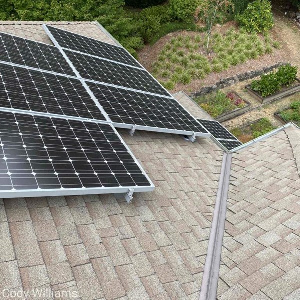 Solar panels installed on Bianbridge Island rooftop. New shingles and metal flashings were installed prior to the solar panels to support the life of the new panels.