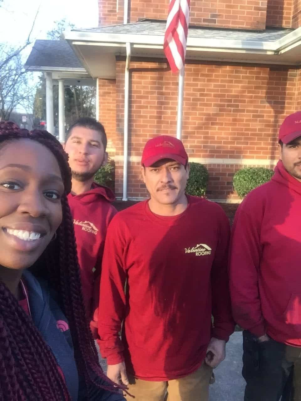 A lady homeowner taking selfie with our roofers