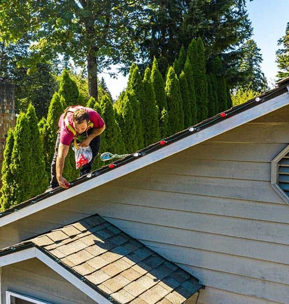 Christmas light installation on a roof in Seattle