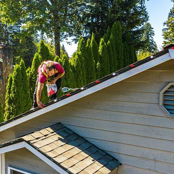 Christmas light installation on a roof in Seattle