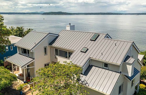 Metal standing seam panel roof installation in Seattle, Washington