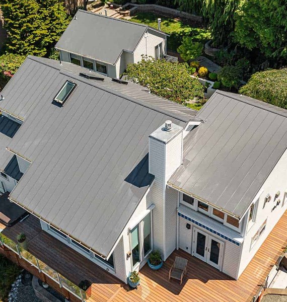 Gray metal roof installation project in Seattle, Washington