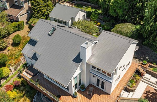 Gray metal roof installation project in Seattle, Washington
