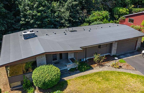 A dark brown single ply PVC roof installed on a home in Des Moines, WA