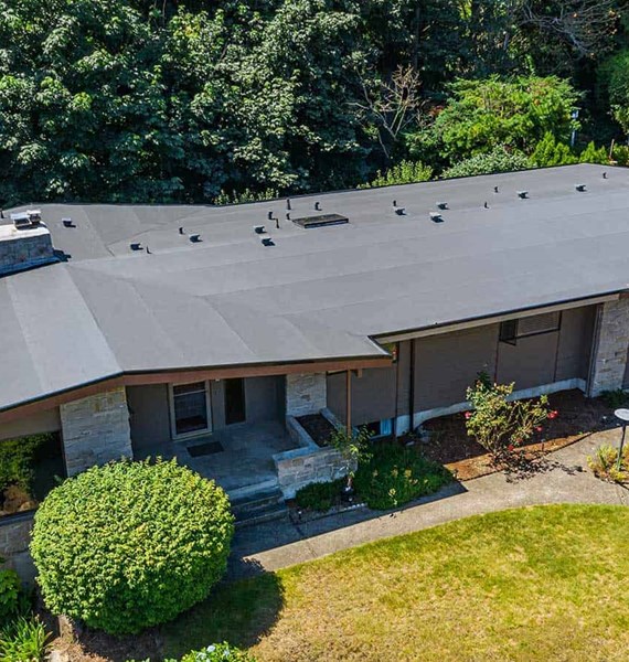 A dark brown single ply PVC roof installed on a home in Des Moines, WA