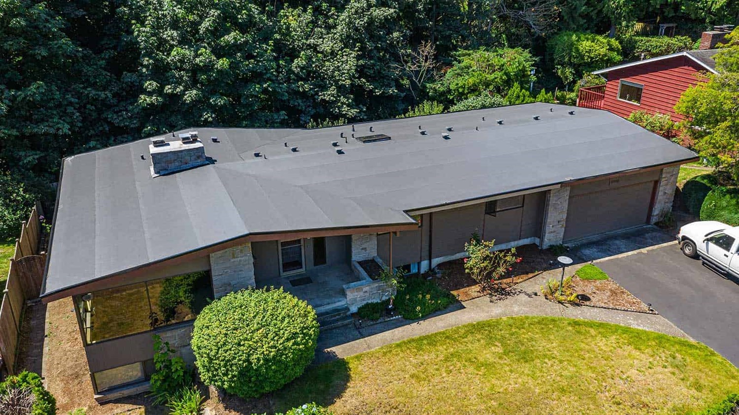 A dark brown single ply PVC roof installed on a home in Des Moines, WA