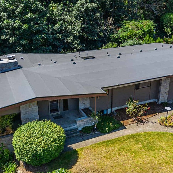A dark brown single ply PVC roof installed on a home in Des Moines, WA