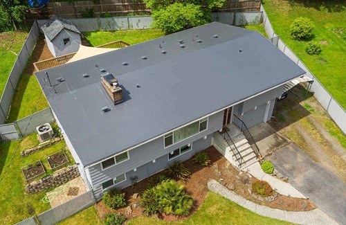 A dark gray PVC single ply roof installed in Seattle, WA 