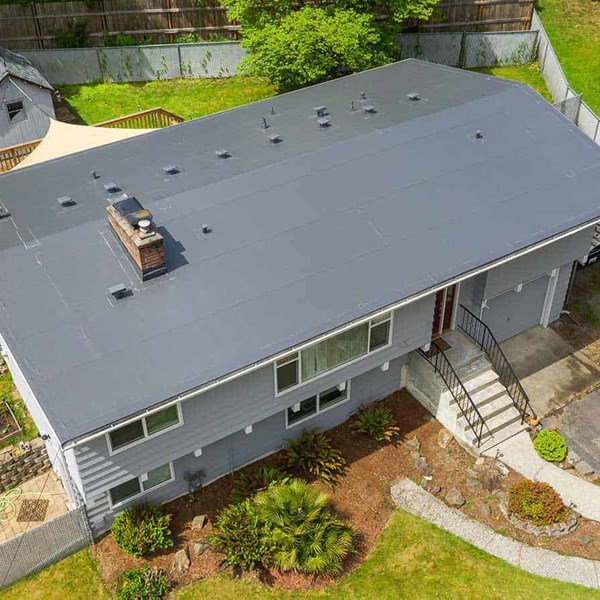 A dark gray PVC single ply roof installed in Seattle, WA