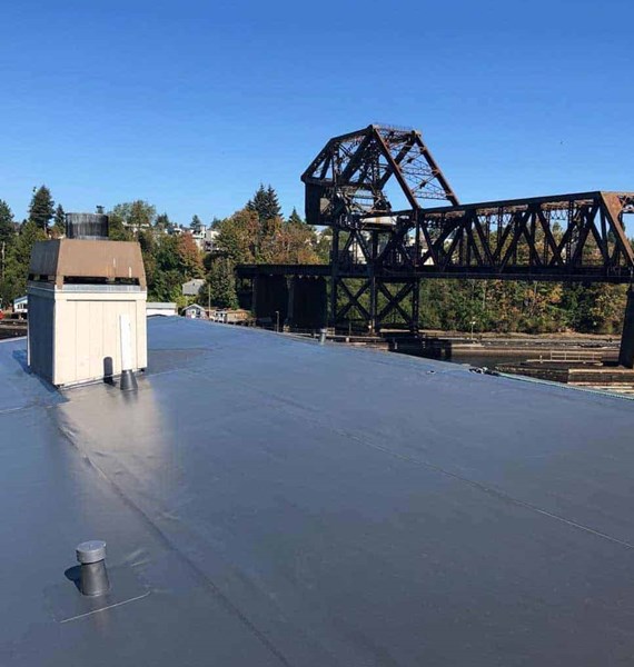 A dark brown PVC single ply roof membrane on a business in Ballard, WA 