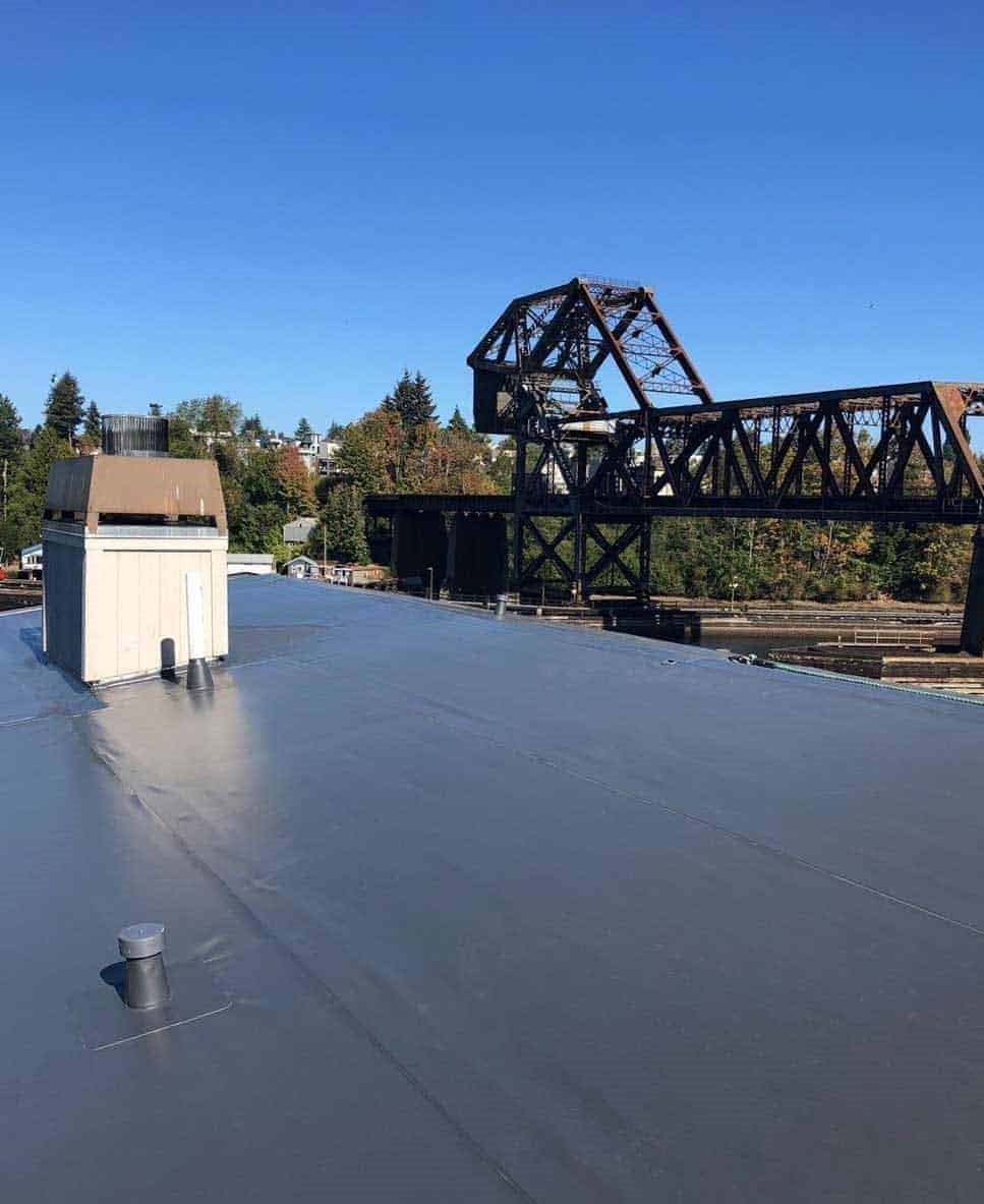 A dark brown PVC single ply roof membrane on a business in Ballard, WA 