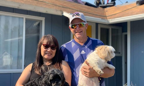 Rob and Therese outside their home