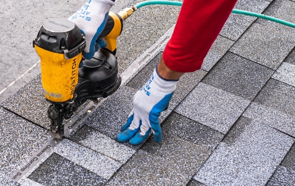 Seattle roof repair contractor fixing missing and damaged shingles