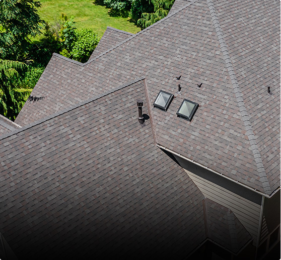 New composite roofing shingles installed on residential roof in Seattle