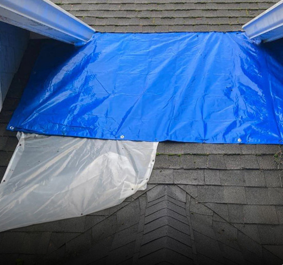 Emergency roof patch on residential roof in Seattle, WA