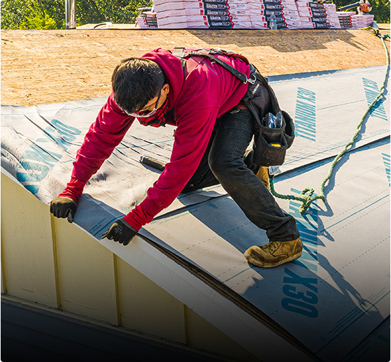 Roofing contractor in Seattle replacing composite roof on residential home