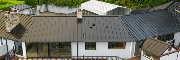 Black, metal panel roof on 1-story house in Seattle, Washington