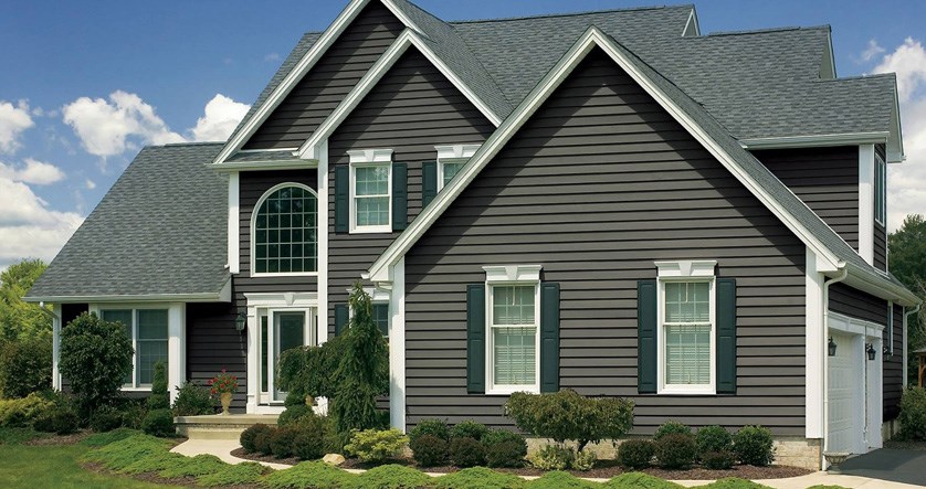 Home with dark composite siding