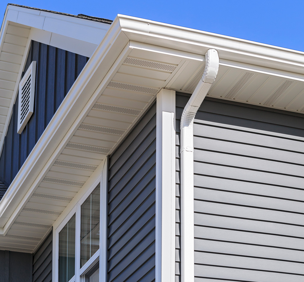 Siding, soffit, and gutter details on a home